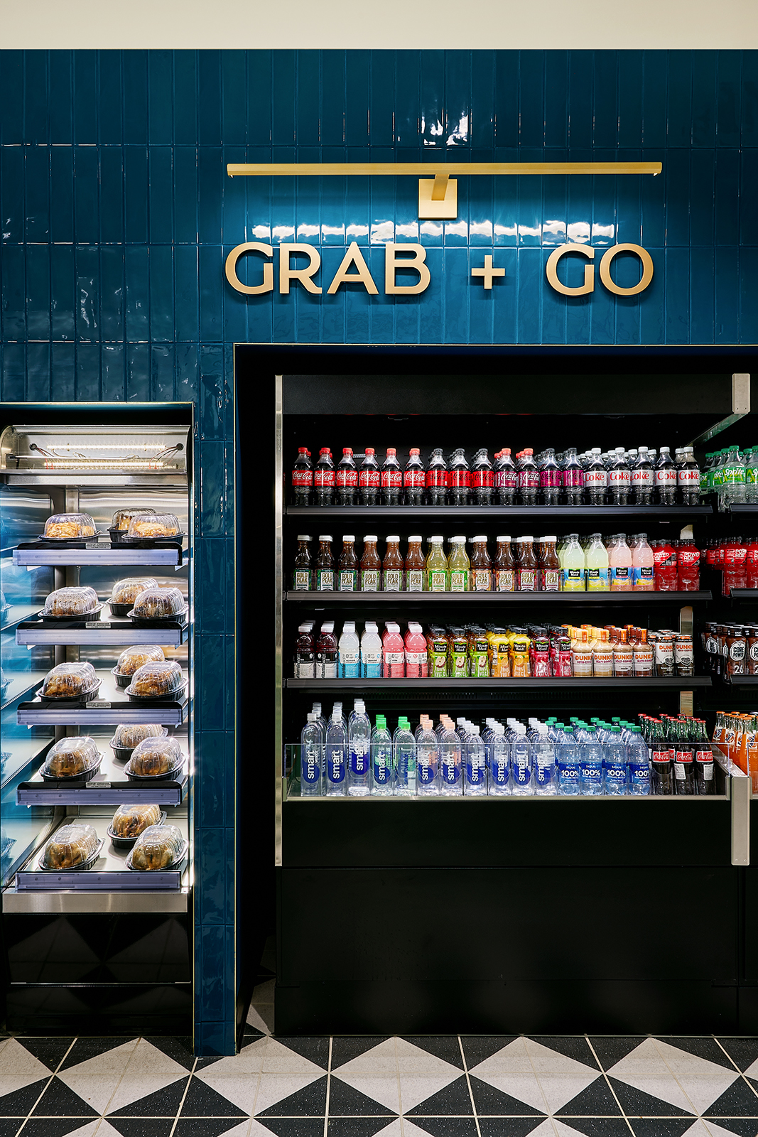 Nemacolin Grab + Go section of the grocery store with beverages on shelves.