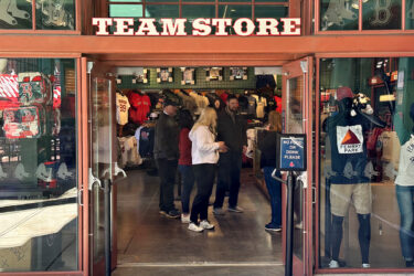 RCS employees standing in the entrance to the Boston Red Sox stadium retail store.