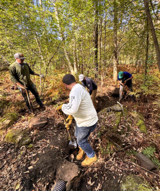 Keith, Matt and Kevin digging drainage for a section of the upper valley rail trail.