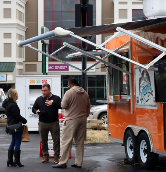 Talking to customers outside the Johnny's Seafood Shack food truck.